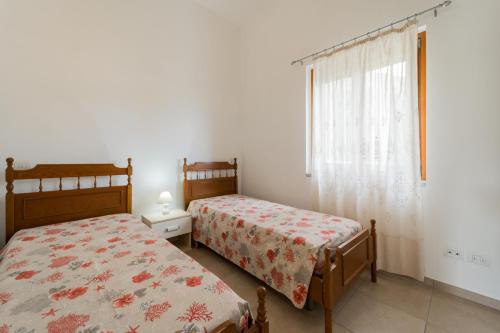 Postel nebo postele na pokoji v ubytování Casa Francesca a Rio - Goelba