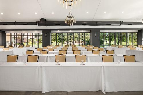 a banquet hall with white tables and chairs at Ann Arbor Marriott Ypsilanti at Eagle Crest in Ann Arbor