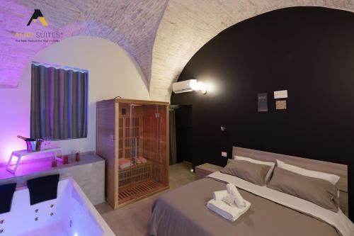 Ένα ή περισσότερα κρεβάτια σε δωμάτιο στο [Alibi Suites] Suite Fieramosca Spa & Relax