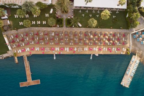 an aerial view of a resort with a pool of water at Prive Hotel Bodrum - Adult Only in Bodrum City