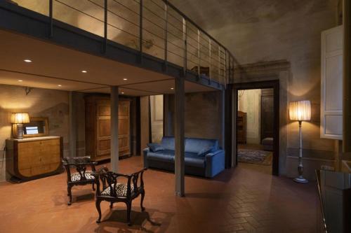 a room with a loft bed and a couch at Renaissance Palace Noble Floor Apartment in Florence