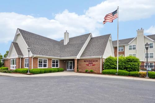 a building with an american flag in front of it at Residence Inn Lexington South Hamburg Place in Lexington