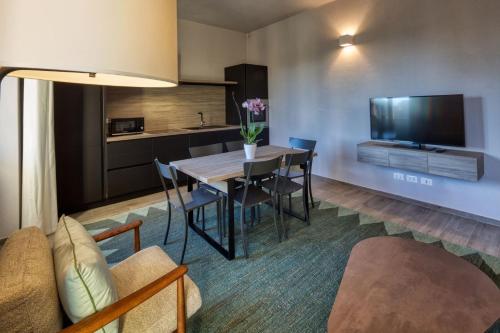 TV a/nebo společenská místnost v ubytování Residence Via Di Francia