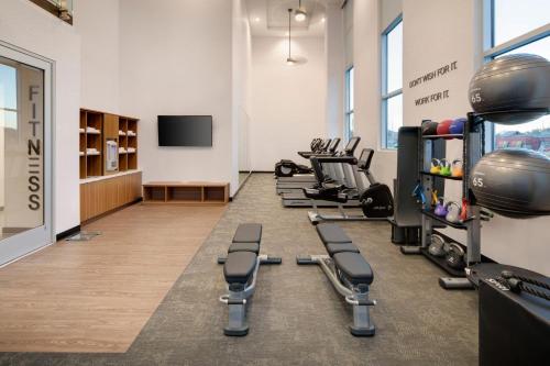 a fitness room with several treadmills and weights at Fairfield by Marriott Inn & Suites Franklin Cool Springs in Franklin