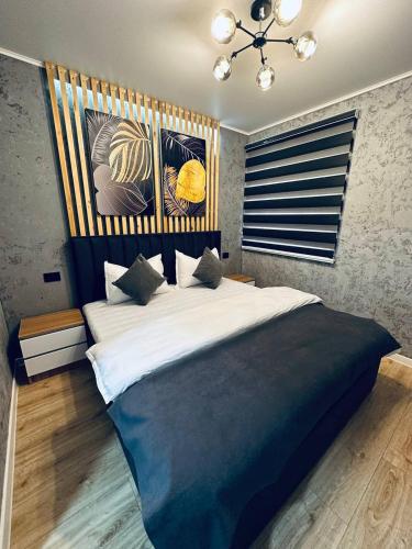 a bedroom with a large bed in a room at Yas 2 Apartment in Samarkand