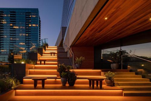 a set of stairs with tables and potted plants at W Nashville in Nashville