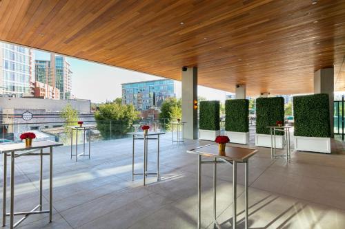 a group of tables in a building with a view at W Nashville in Nashville