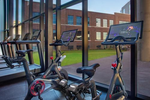 two exercise bikes parked next to a window in a gym at W Nashville in Nashville
