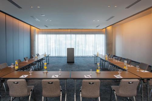 a conference room with a long table and chairs at W Nashville in Nashville