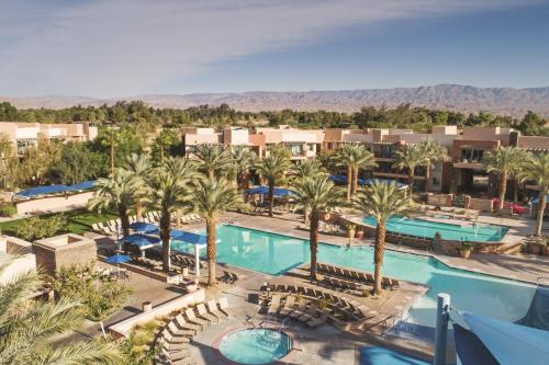 an aerial view of a resort pool with palm trees at Marriott's Shadow Ridge II - The Enclaves in Palm Desert