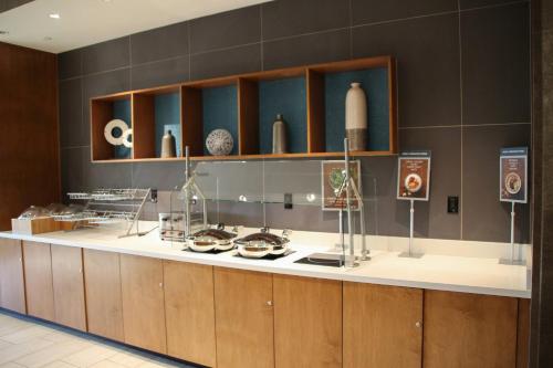 a kitchen with a counter with bowls on it at Springhill Suites Baltimore White Marsh/Middle River in Middle River