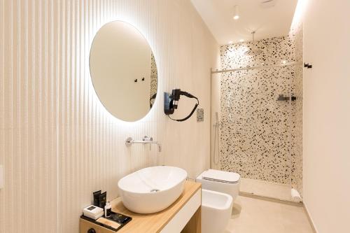 a bathroom with a sink and a toilet and a shower at Giada Luxury in Terrasini