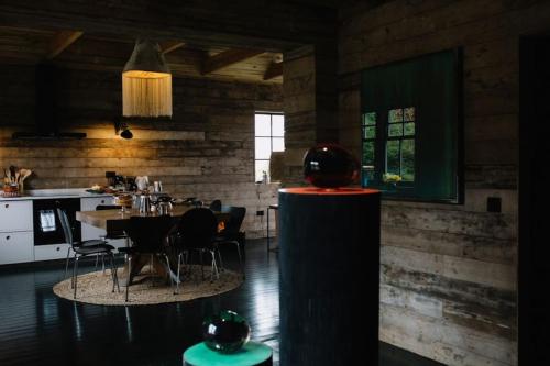 a kitchen and dining room with a table and chairs at The Artist's House at Jupiter Artland in Kirknewton