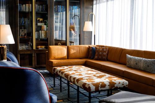 a living room with a couch and a coffee table at The Barfield, Autograph Collection in Amarillo