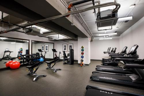 a gym with several treadmills and cardio machines at The Barfield, Autograph Collection in Amarillo