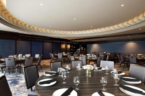 a large dining room with tables and chairs at The Barfield, Autograph Collection in Amarillo
