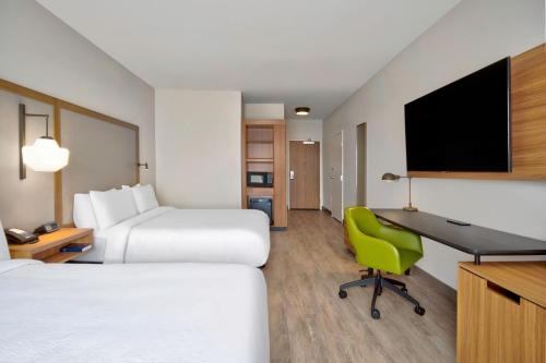 a hotel room with two beds and a desk with a computer at Fairfield by Marriott Inn & Suites Cincinnati North West Chester in West Chester