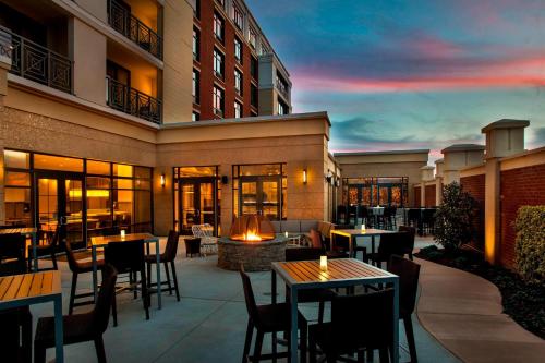 a patio with tables and chairs and a building at Courtyard by Marriott Philadelphia Lansdale in Lansdale