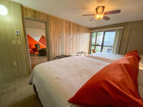 a bedroom with two beds and a ceiling fan at Cozy Retreat Just Minutes From Beech Mountain in Beech Mountain