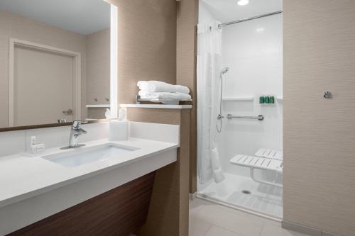 a bathroom with a sink and a shower at Fairfield Inn & Suites by Marriott Memphis Marion, AR in Marion