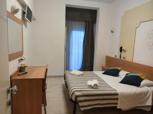 Postel nebo postele na pokoji v ubytování Hotel Jolie