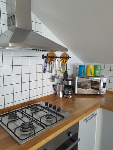 a kitchen with a stove top oven in a kitchen at Marina Holiday Home in Pizzo