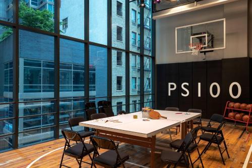 a conference room with a table and a basketball hoop at Moxy NYC Downtown in New York