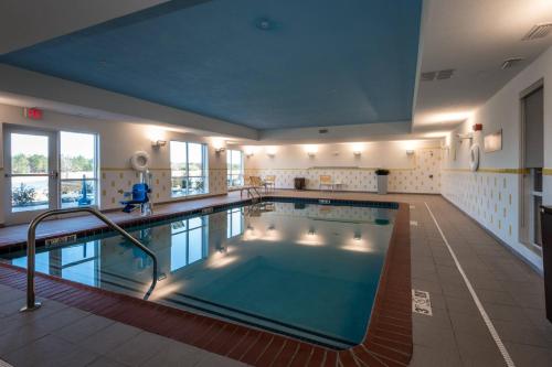 a large indoor swimming pool in a building at Fairfield Inn & Suites by Marriott Atmore in Atmore