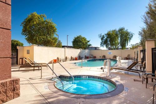 a pool with a hot tub on a patio at Fairfield Inn and Suites Phoenix Chandler Fashion Center in Chandler