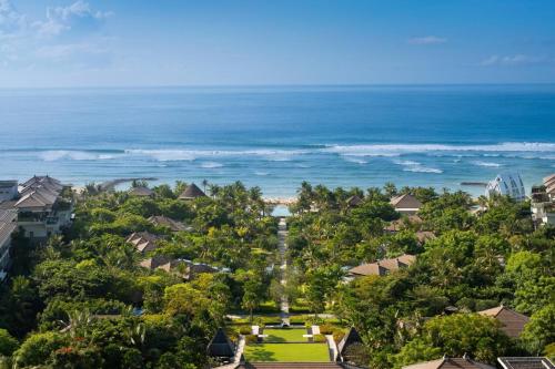 an aerial view of a resort with the ocean at The Ritz-Carlton Bali in Nusa Dua