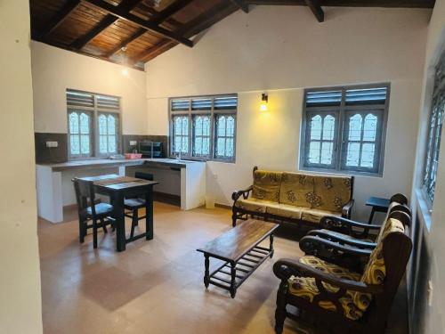 a living room with a couch and a table at Susha Happy One 2BR First Floor Apartment in Hikkaduwa