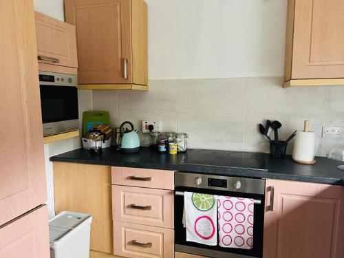 a kitchen with a stove with a dish towel on it at Sheffield house on the hill in Manor