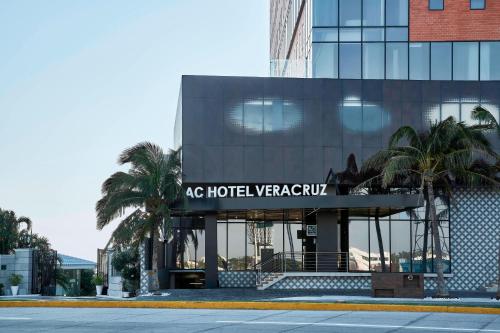 a building with a sign that reads ac hotel las vegascu at AC Hotel by Marriott Veracruz in Veracruz