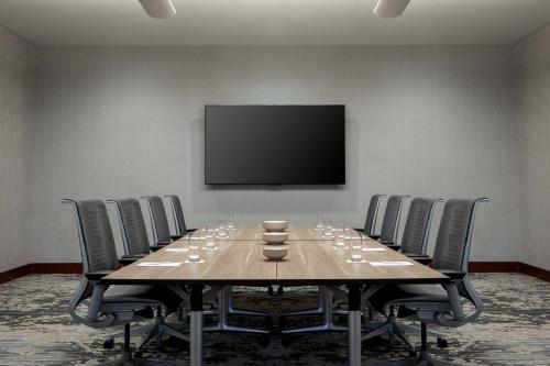 a conference room with a long table with wine glasses on it at JW Marriott Grand Rapids in Grand Rapids