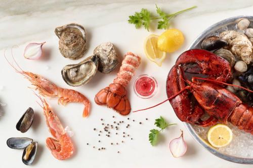 a plate of seafood on a white table at JW Marriott Grand Rapids in Grand Rapids