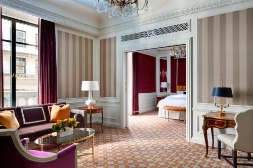 a living room with a couch and a bed at The St. Regis New York in New York