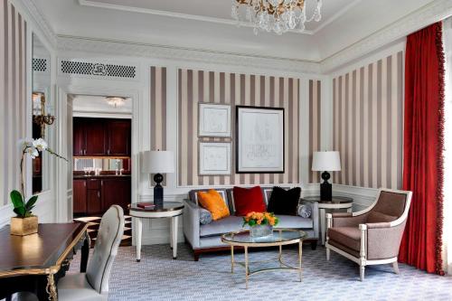 a living room with a couch and a table at The St. Regis New York in New York