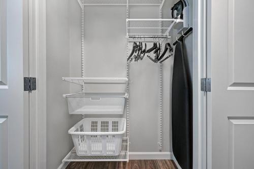 a laundry room with baskets and a door at TownePlace Suites Sacramento Airport Natomas in Sacramento