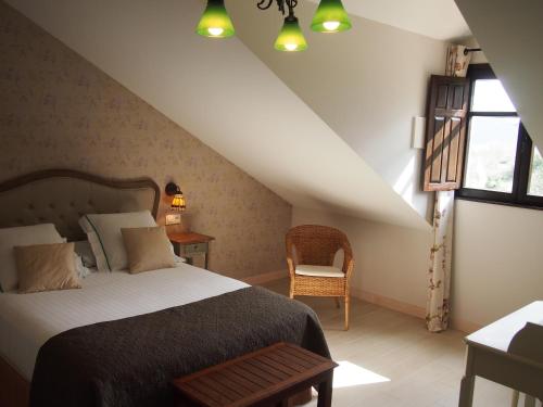 a bedroom with a large bed and a staircase at El Rincón de Escalante in Escalante