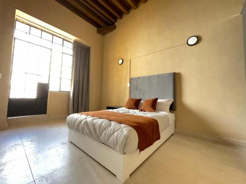 Colmena Hotel CDMX Centroにあるベッド