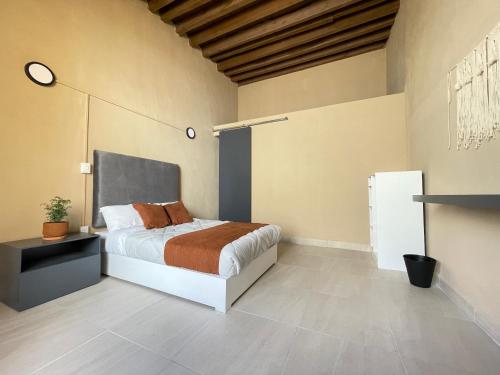 a bedroom with a bed in a room at Colmena Hotel CDMX Centro in Mexico City