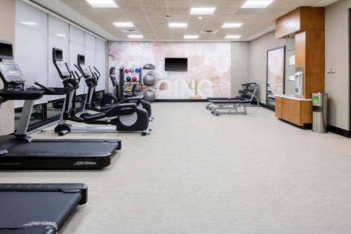 a gym with treadmills and elliptical machines at SpringHill Suites By Marriott Durham City View in Durham