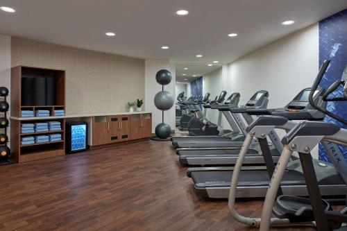 a gym with rows of treadmills and machines at Delta Hotels by Marriott Little Rock West in Little Rock