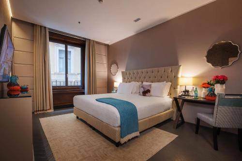 Ένα ή περισσότερα κρεβάτια σε δωμάτιο στο Singer Palace Hotel Roma