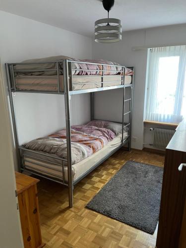 a bedroom with two bunk beds in a room at annelise in Leukerbad