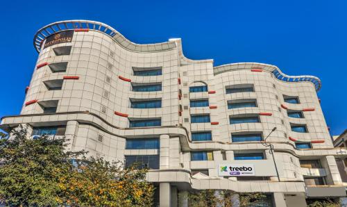 a building with a nikko sign in front of it at Treebo Tryst Metropolis in Hyderabad