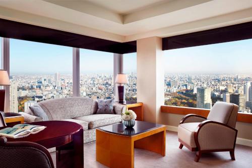 a living room with a view of a city at The Ritz-Carlton, Tokyo in Tokyo