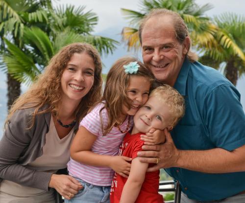 a man and two women and a child posing for a picture at Hotel La Campagnola - Green Energy Resort in San Nazzaro