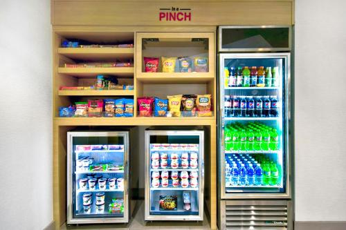 a refrigerator filled with lots of drinks and drinks at TownePlace Suites by Marriott Asheville West in Asheville