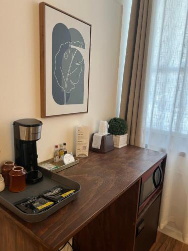 a desk with a coffee maker on top of it at The Brooks Hotel Restaurant and Lounge in Wallace
